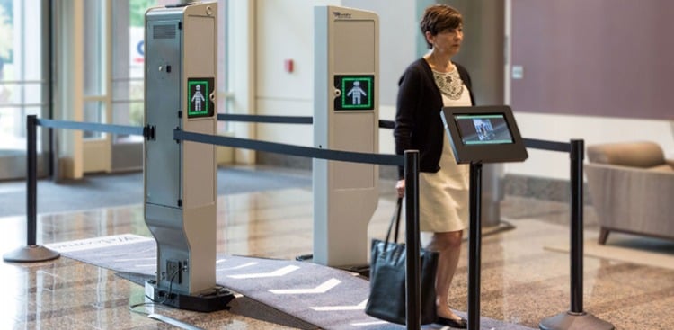 Woman walks through Evolv terminal.