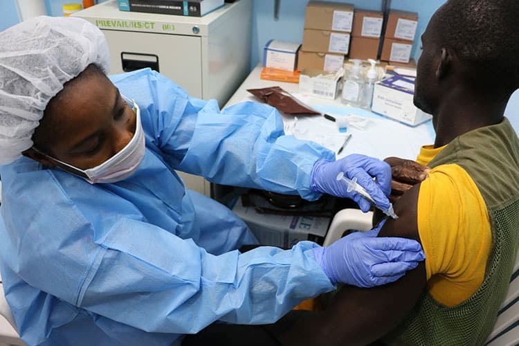 Study volunteer receives an Ebola inoculation at Redemption Hospital in Monrovia, Liberia. 