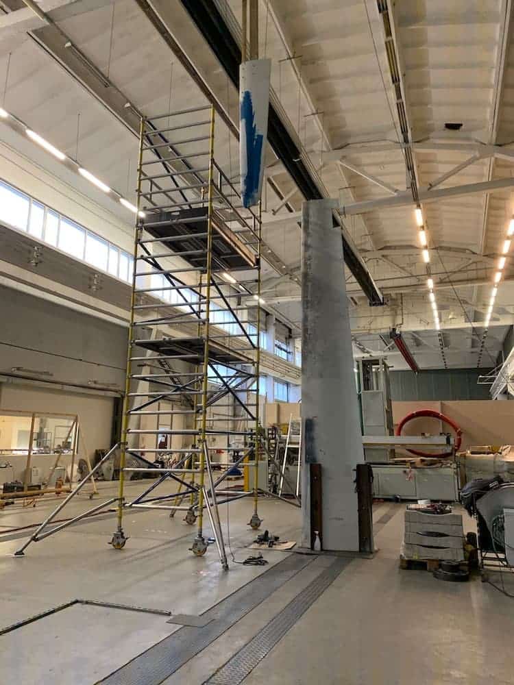 The company's development warehouse houses a full-size wind turbine blade for testing