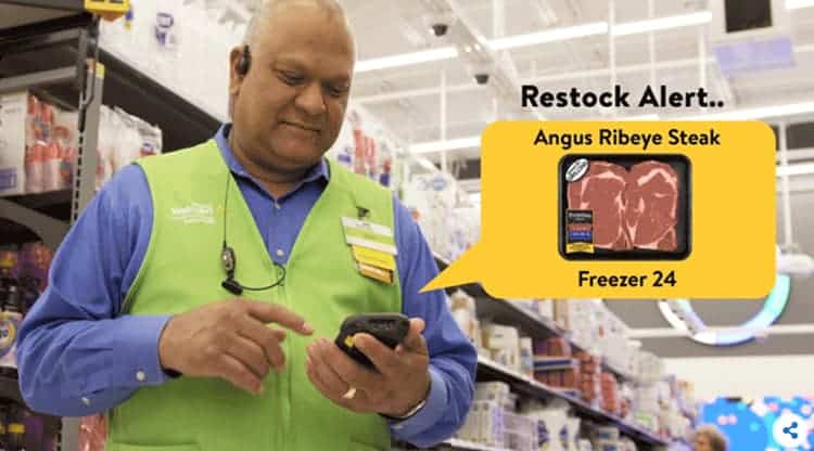 An associate in the new IRL Walmart store.