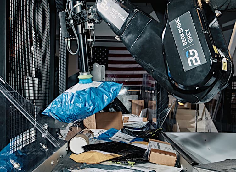 A robotic arm sorts packages